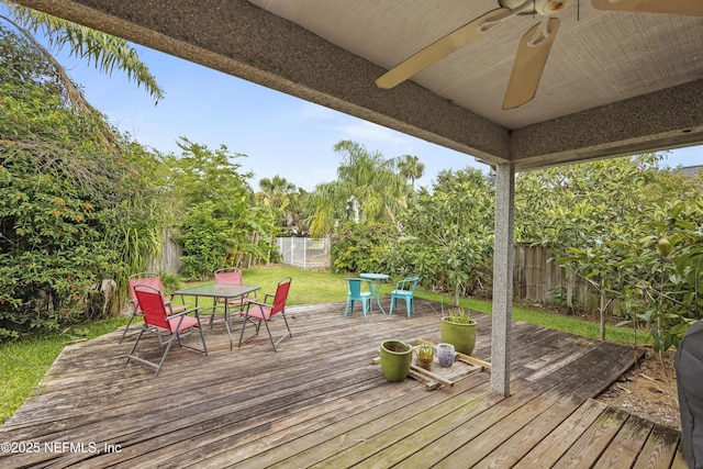 1419 Linkside Dr, Atlantic Beach, FL 32233 - wooden deck featuring outdoor dining area, a ceiling fan, and a fenced backyard