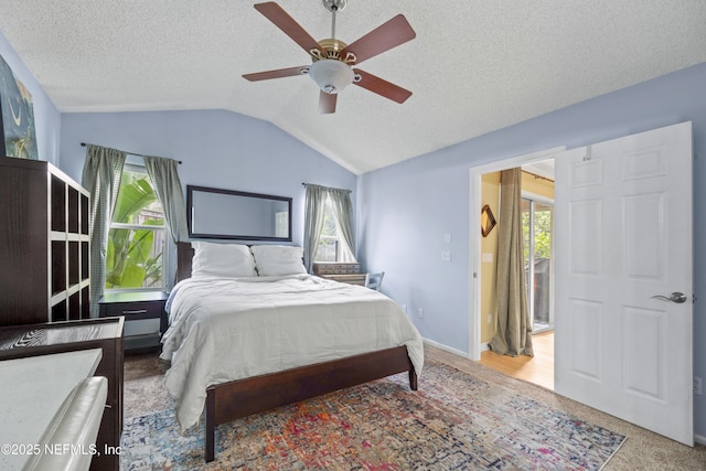 1419 Linkside Dr, Atlantic Beach, FL 32233 - bedroom featuring multiple windows, vaulted ceiling, a textured ceiling, and a ceiling fan