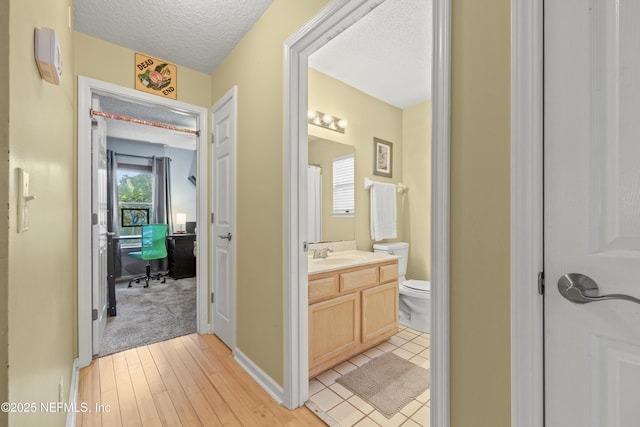 1419 Linkside Dr, Atlantic Beach, FL 32233 - hall with a textured ceiling, a desk, and light wood finished floors