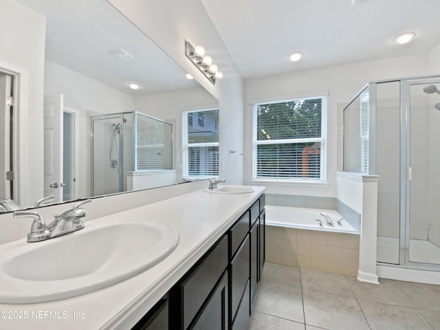 1090 Lauriston Dr, Saint Johns, FL 32259 - bathroom with double vanity, a garden tub, a shower stall, tile patterned flooring, and recessed lighting