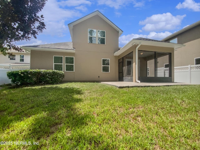 1090 Lauriston Dr, Saint Johns, FL 32259 - back of property featuring a sunroom, stucco siding, and a patio area