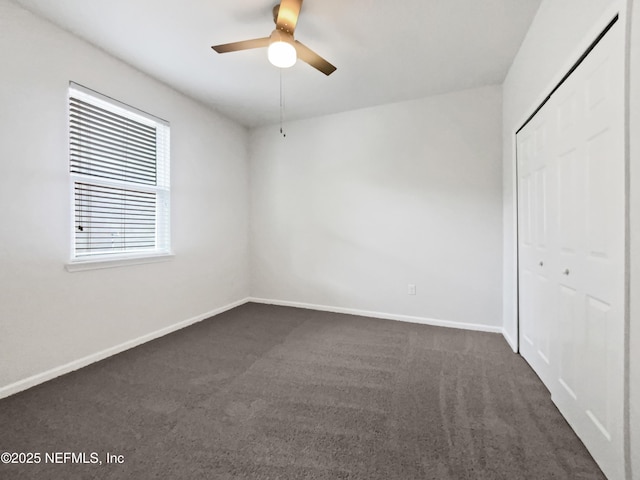 1090 Lauriston Dr, Saint Johns, FL 32259 - unfurnished bedroom featuring dark colored carpet, a closet, and a ceiling fan