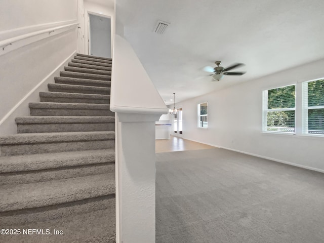 1090 Lauriston Dr, Saint Johns, FL 32259 - stairway with ceiling fan, carpet flooring, and a chandelier