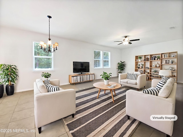 1090 Lauriston Dr, Saint Johns, FL 32259 - living room featuring a chandelier, light tile patterned floors, and a ceiling fan