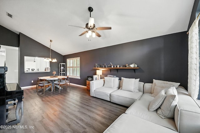 14410 Pelican Bay Ct, Jacksonville, FL 32224 - living room with wood finished floors, vaulted ceiling, ceiling fan, and a chandelier