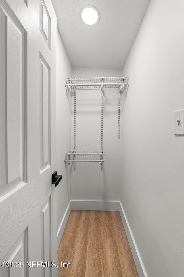 2571 Montreal St, Jacksonville, FL 32233 - walk in closet featuring wood finished floors
