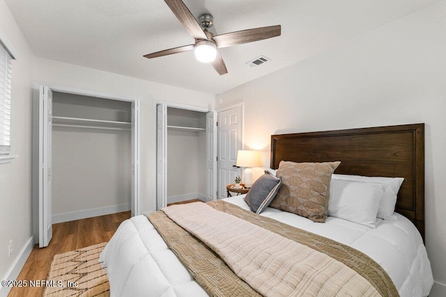 2571 Montreal St, Jacksonville, FL 32233 - bedroom with two closets, wood finished floors, and ceiling fan