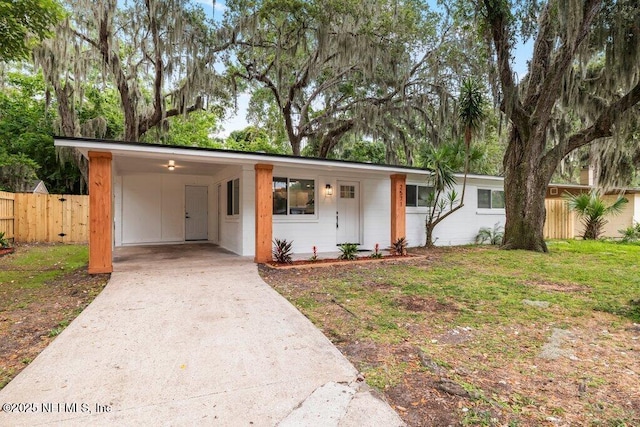2571 Montreal St, Jacksonville, FL 32233 - ranch-style house featuring driveway and an attached carport