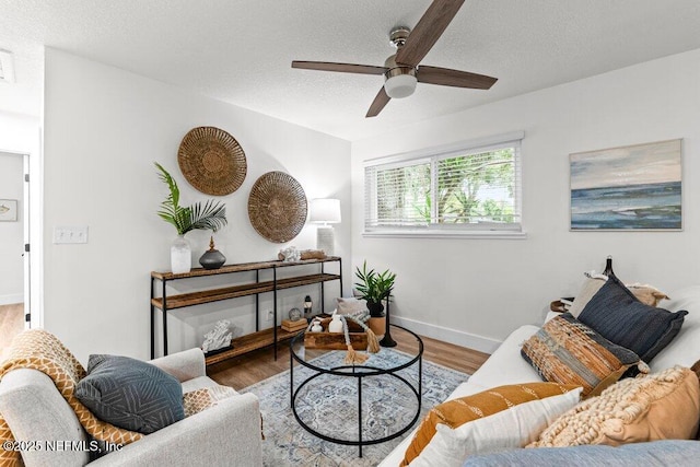 2571 Montreal St, Jacksonville, FL 32233 - living room with a ceiling fan, wood finished floors, and a textured ceiling