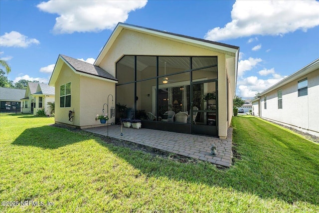 814 Copperhead Cir, Saint Augustine, FL 32092 - rear view of house with a patio, a lawn, and stucco siding