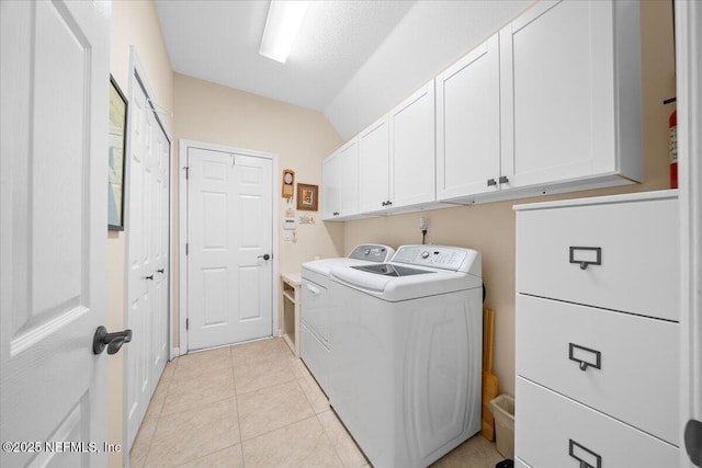 814 Copperhead Cir, Saint Augustine, FL 32092 - laundry area with washer and dryer, cabinet space, and light tile patterned floors