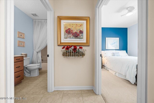 814 Copperhead Cir, Saint Augustine, FL 32092 - hallway featuring light tile patterned flooring and baseboards