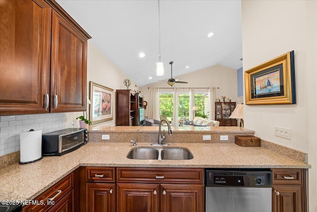 814 Copperhead Cir, Saint Augustine, FL 32092 - kitchen featuring stainless steel dishwasher, a peninsula, lofted ceiling, tasteful backsplash, and light stone countertops