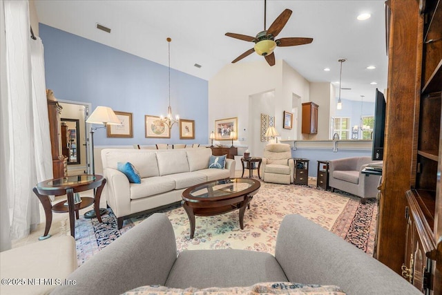 814 Copperhead Cir, Saint Augustine, FL 32092 - living room with a ceiling fan, a chandelier, high vaulted ceiling, and recessed lighting