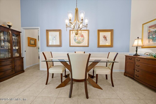 814 Copperhead Cir, Saint Augustine, FL 32092 - dining area with a chandelier, a towering ceiling, and light tile patterned floors