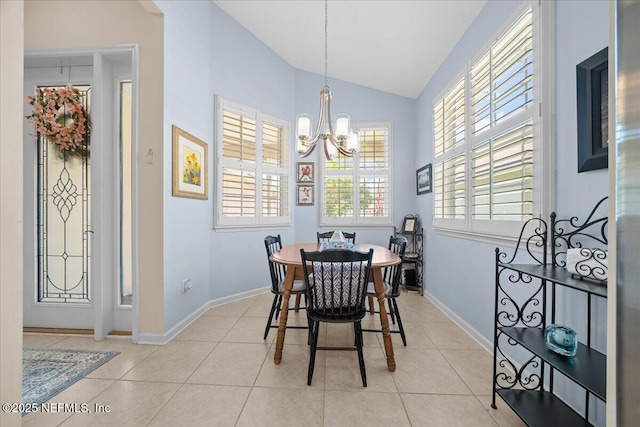 814 Copperhead Cir, Saint Augustine, FL 32092 - dining room featuring a chandelier, vaulted ceiling, and light tile patterned floors