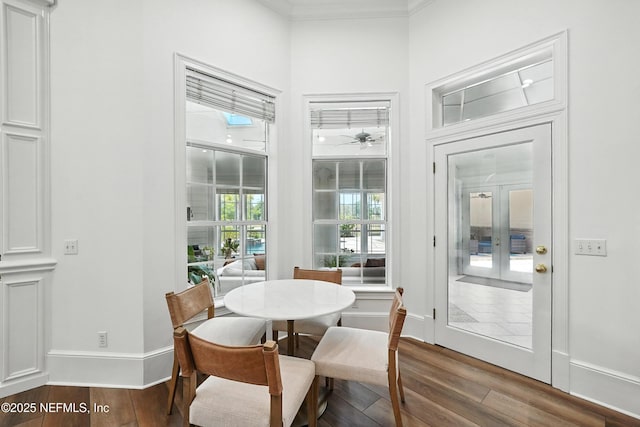 24237 Marsh Landing Pkwy, Ponte Vedra Beach, FL 32082 - dining space featuring wood finished floors, crown molding, and a ceiling fan