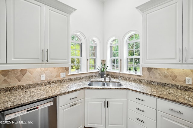 24237 Marsh Landing Pkwy, Ponte Vedra Beach, FL 32082 - kitchen featuring stainless steel dishwasher, stone counters, white cabinetry, and tasteful backsplash