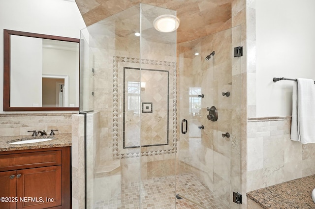 24237 Marsh Landing Pkwy, Ponte Vedra Beach, FL 32082 - full bath with tile walls, vanity, and a stall shower