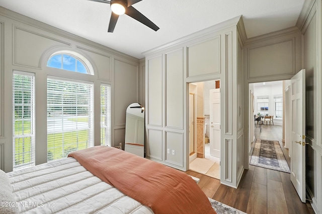 24237 Marsh Landing Pkwy, Ponte Vedra Beach, FL 32082 - bedroom with a decorative wall, dark wood-style floors, ensuite bath, and a ceiling fan