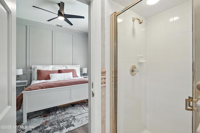 24237 Marsh Landing Pkwy, Ponte Vedra Beach, FL 32082 - full bathroom featuring ensuite bathroom, a decorative wall, a stall shower, and ceiling fan