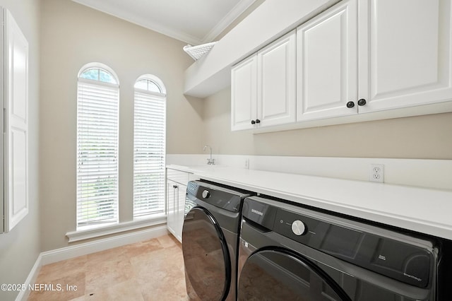 24237 Marsh Landing Pkwy, Ponte Vedra Beach, FL 32082 - washroom featuring washer and clothes dryer, ornamental molding, and cabinet space