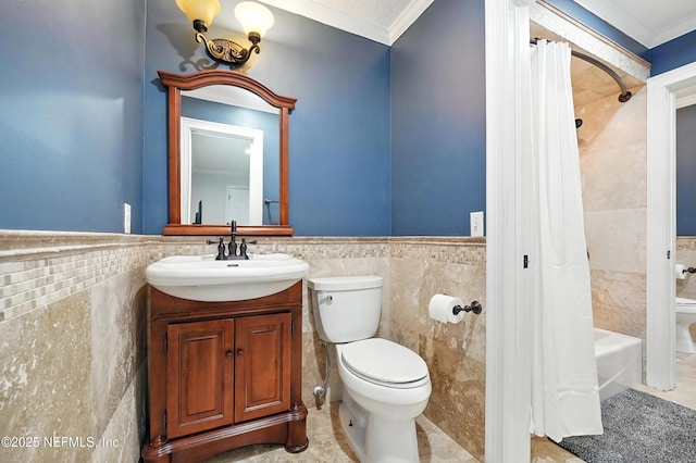 24237 Marsh Landing Pkwy, Ponte Vedra Beach, FL 32082 - full bath with tile walls, ornamental molding, vanity, shower / bath combo with shower curtain, and a wainscoted wall