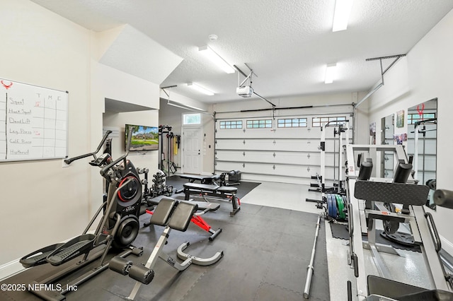24237 Marsh Landing Pkwy, Ponte Vedra Beach, FL 32082 - workout area with a textured ceiling and a garage