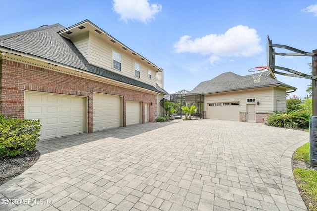 24237 Marsh Landing Pkwy, Ponte Vedra Beach, FL 32082 - view of home's exterior with brick siding, driveway, and a shingled roof