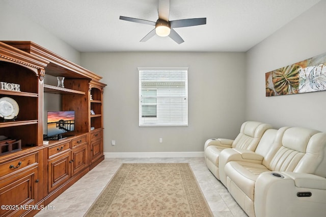 29 Lagoon Way, Palm Coast, FL 32137 - living area featuring a ceiling fan and baseboards