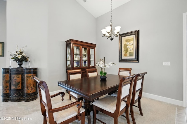 29 Lagoon Way, Palm Coast, FL 32137 - dining area with high vaulted ceiling and a chandelier