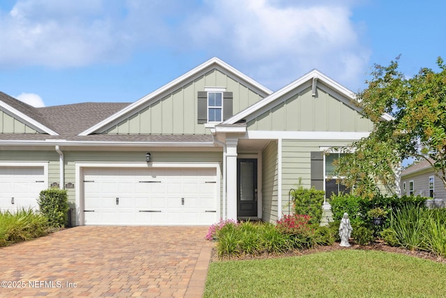 3146 Villa Vera Ct, Jacksonville, FL 32246 - view of front of house featuring board and batten siding, decorative driveway, a shingled roof, and a garage