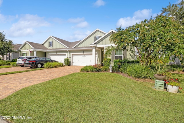 3146 Villa Vera Ct, Jacksonville, FL 32246 - craftsman house featuring board and batten siding, decorative driveway, a front yard, and a garage