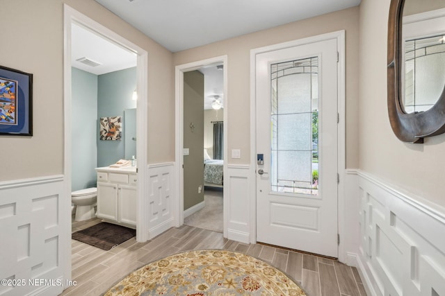 3146 Villa Vera Ct, Jacksonville, FL 32246 - entryway with wood finish floors and a wainscoted wall