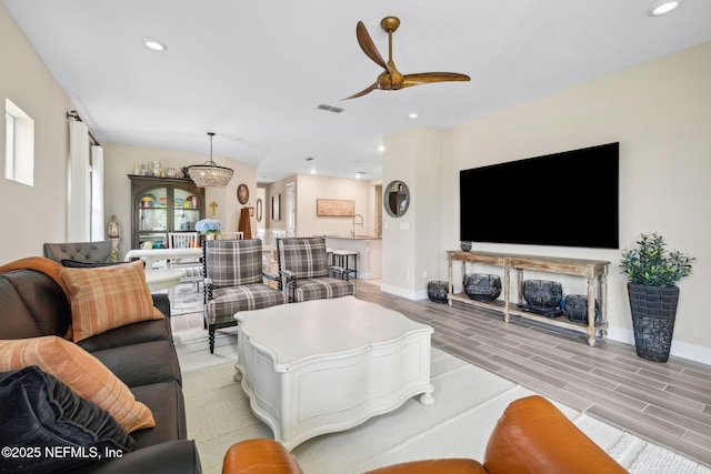 3146 Villa Vera Ct, Jacksonville, FL 32246 - living room with a ceiling fan, recessed lighting, and light wood finished floors