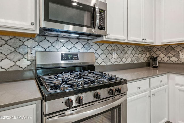 3146 Villa Vera Ct, Jacksonville, FL 32246 - kitchen featuring appliances with stainless steel finishes, white cabinets, decorative backsplash, and light countertops