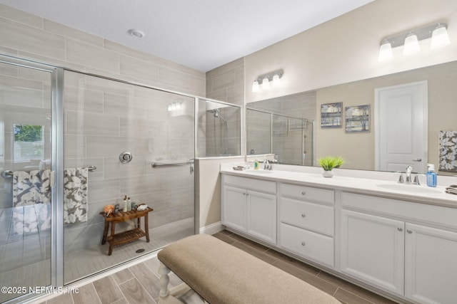 3146 Villa Vera Ct, Jacksonville, FL 32246 - full bathroom with double vanity, a stall shower, and wood finish floors