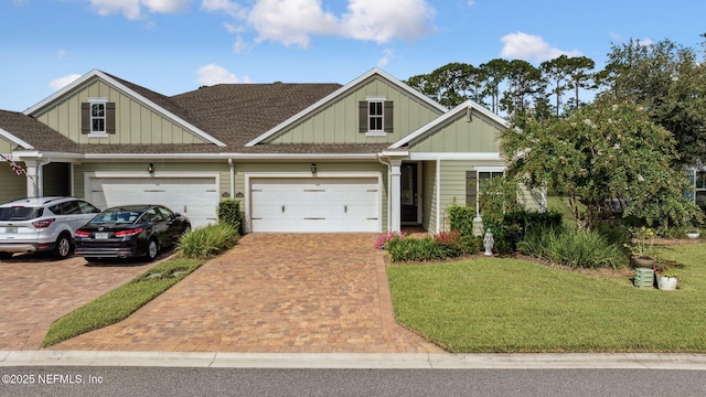3146 Villa Vera Ct, Jacksonville, FL 32246 - view of front facade featuring board and batten siding, decorative driveway, a front yard, and a shingled roof