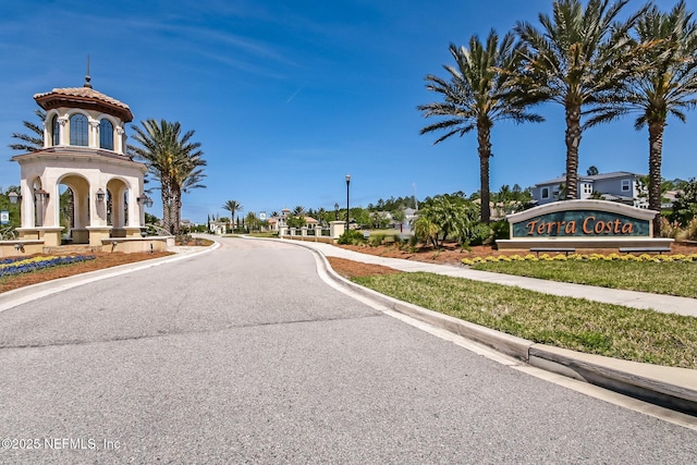 3146 Villa Vera Ct, Jacksonville, FL 32246 - view of asphalt road with sidewalks, street lights, and curbs