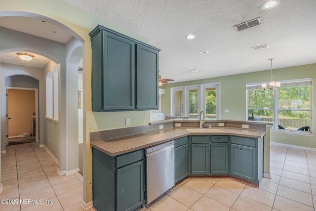 3350 Silverado Cir, Green Cove Springs, FL 32043 - kitchen with dishwasher, light tile patterned floors, a peninsula, recessed lighting, and a textured ceiling