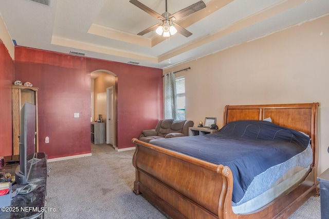 3350 Silverado Cir, Green Cove Springs, FL 32043 - bedroom featuring arched walkways, a raised ceiling, light colored carpet, and ceiling fan