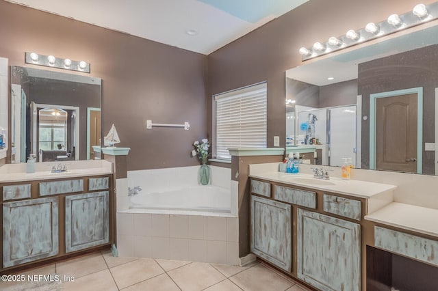 3350 Silverado Cir, Green Cove Springs, FL 32043 - bathroom featuring tile patterned flooring, a garden tub, two vanities, and a shower stall