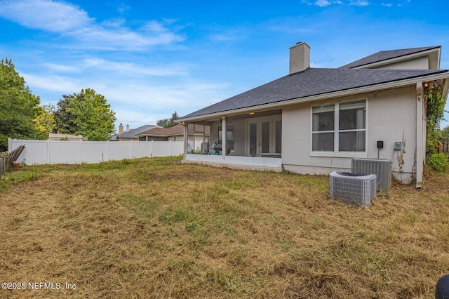 3350 Silverado Cir, Green Cove Springs, FL 32043 - rear view of house with a chimney, french doors, a shingled roof, and a sunroom