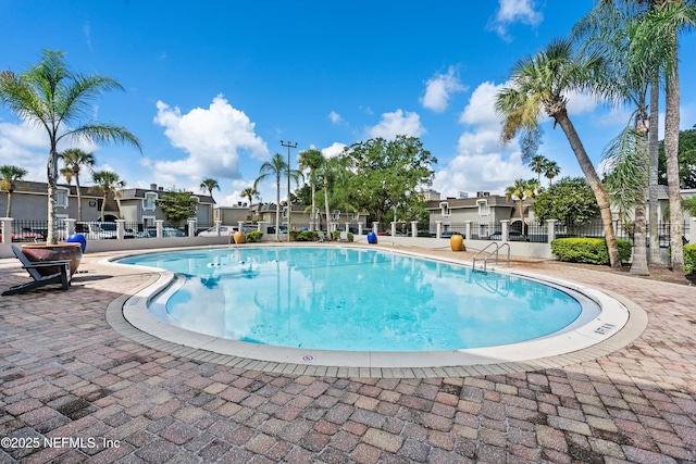 355 Monument Rd Unit 15D1, Jacksonville, FL 32225 - community pool with a patio area and a residential view