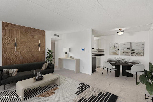 355 Monument Rd Unit 15D1, Jacksonville, FL 32225 - living area with light tile patterned floors and a textured ceiling