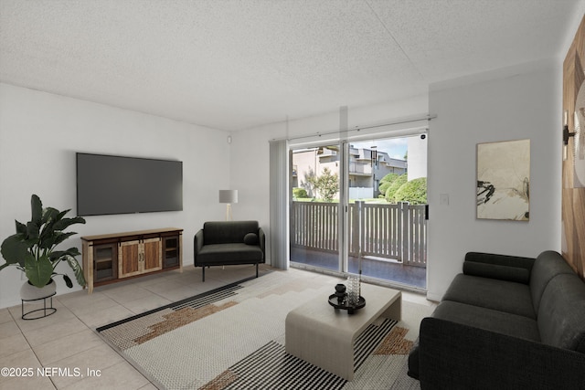 355 Monument Rd Unit 15D1, Jacksonville, FL 32225 - tiled living area with a textured ceiling