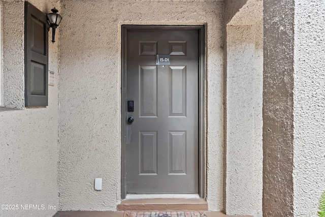 355 Monument Rd Unit 15D1, Jacksonville, FL 32225 - view of exterior entry featuring stucco siding