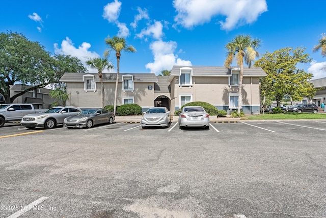 355 Monument Rd Unit 15D1, Jacksonville, FL 32225 - view of property featuring uncovered parking and a residential view
