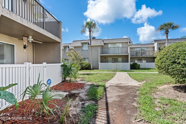 355 Monument Rd Unit 15D1, Jacksonville, FL 32225 - view of yard featuring a balcony and ceiling fan