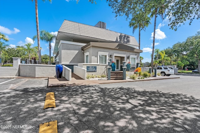 355 Monument Rd Unit 15D1, Jacksonville, FL 32225 - view of front of property featuring mansard roof and stucco siding